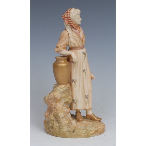 64 - A Royal Worcester blush ivory figure, of a female water carrier, 16cm high, printed crown and circle... 