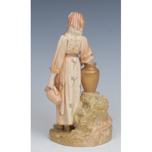 64 - A Royal Worcester blush ivory figure, of a female water carrier, 16cm high, printed crown and circle... 