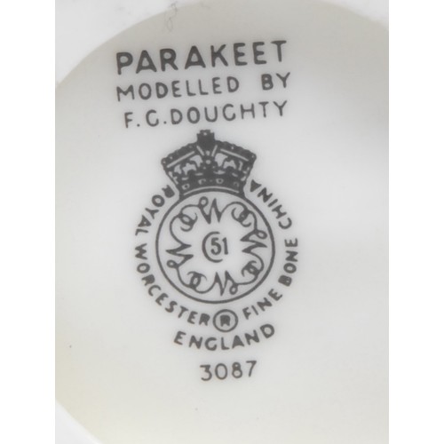 108 - Royal Worcester figure, after James Hadley, of a girl, on a chair, she with hands on her knee, in fl... 