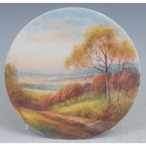 69 - A Royal Worcester circular plaque, painted by R. Rushton, signed, with a view of Oxford from Boars H... 