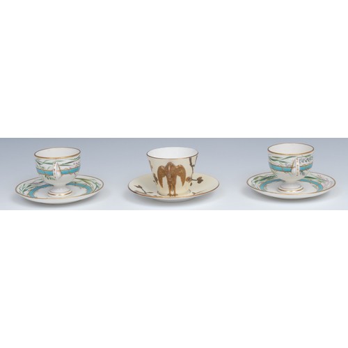 62 - A pair of Royal Worcester pedestal teacups and saucers, painted with grasses over a raised gilt and ... 