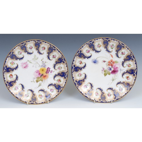 60 - A pair of Royal Worcester circular plates, painted by Ernest Phillips, signed, with colourful summer... 