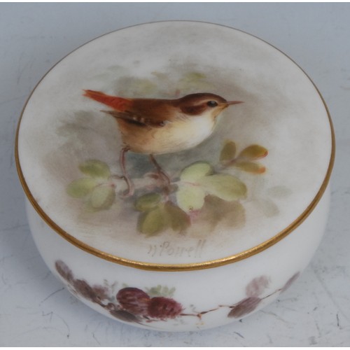 94 - A Royal Worcester plate, painted by W. Powell, signed, with a kingfisher perched on a leafy branch, ... 