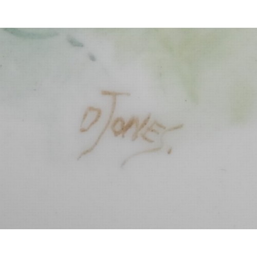 99 - A Royal Worcester teacup and saucer, painted by D. Jones, signed, with a chaffinch and a yellow hamm... 