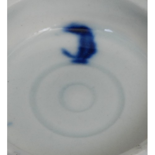103 - A Worcester Bat pattern tea bowl and saucer, decorated in underglaze blue with a chinoiserie garden,... 