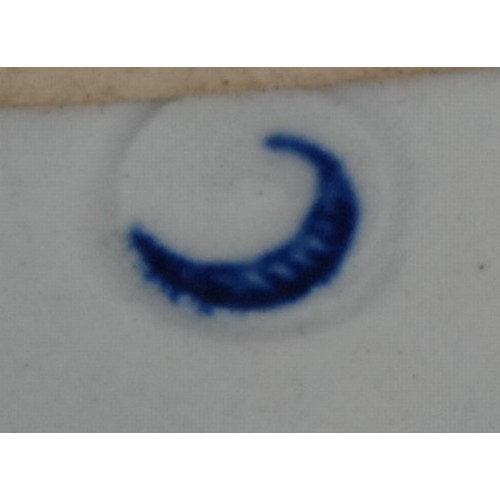 103 - A Worcester Bat pattern tea bowl and saucer, decorated in underglaze blue with a chinoiserie garden,... 