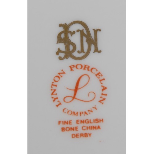 140 - A Lynton coffee can and stand, painted by Stefan Nowacki,  Lion Rock, Dovedale, Derbyshire, the sauc... 