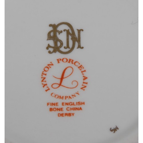 140 - A Lynton coffee can and stand, painted by Stefan Nowacki,  Lion Rock, Dovedale, Derbyshire, the sauc... 