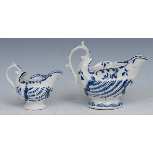 110 - A Derby dolphin ewer cream jug, moulded and painted in tones of blue, 10cm long, c.1768; another (2)