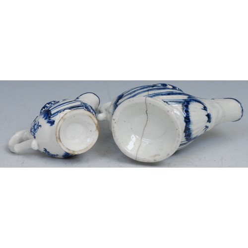 110 - A Derby dolphin ewer cream jug, moulded and painted in tones of blue, 10cm long, c.1768; another (2)