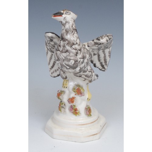 123 - An 18th century Derby patchmark figure, of a girl with basket, scrolling foliate base, 20.5cm high, ... 