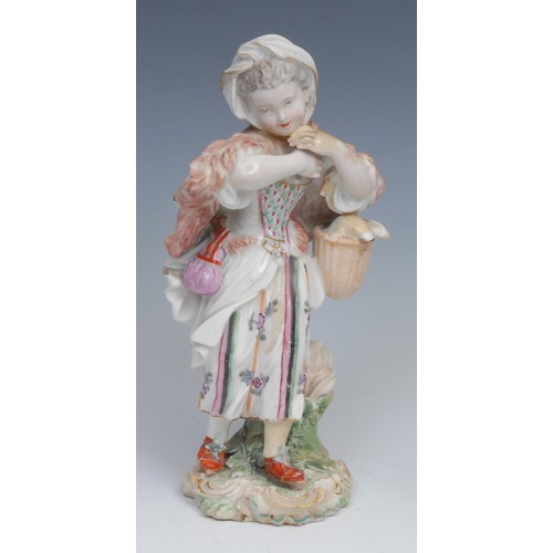 123 - An 18th century Derby patchmark figure, of a girl with basket, scrolling foliate base, 20.5cm high, ... 