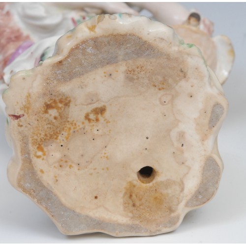 123 - An 18th century Derby patchmark figure, of a girl with basket, scrolling foliate base, 20.5cm high, ... 