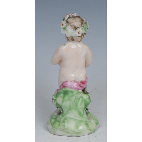 115 - A Derby patch mark figure, Putto, garlanded with flowers, 10cm high, c.1780