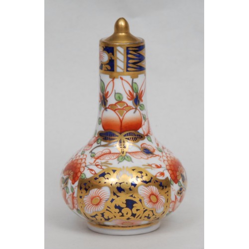 133 - A Sampson Hancock Derby ovoid scent bottle, painted in the Imari palette, 9cm high, red mark; anothe... 