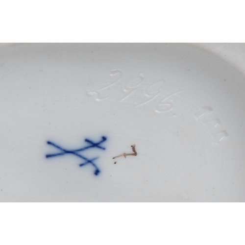 157 - A German porcelain figure group, putti suitors gathering blooms, 12cm high, impressed 2996, crossed ... 