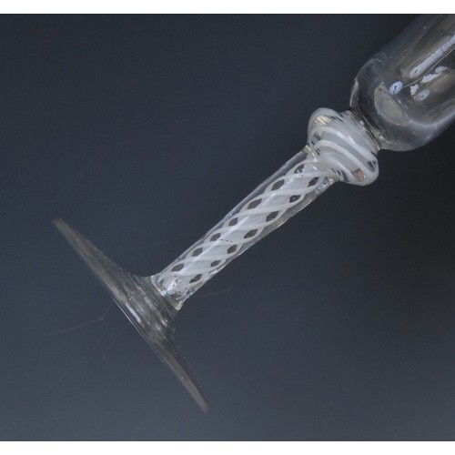 198 - A George III opaque twist wine glass, trumpet shaped bowl, knopped stem with double-helix, circular ... 