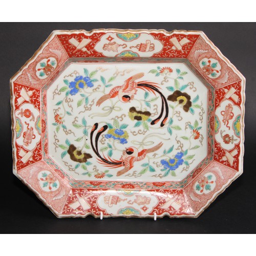 211 - A 19th century Chinese canted rectangular dish, the field painted in polychrome enamels with fancifu... 