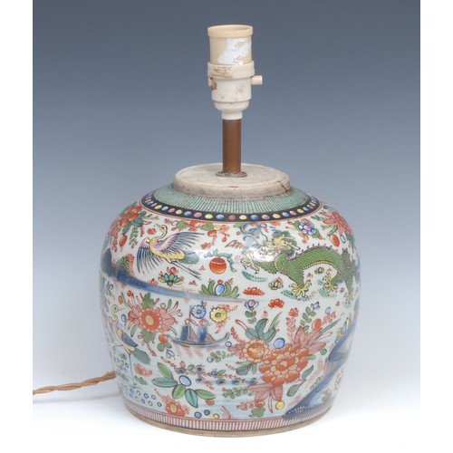 250 - A Chinese ovoid doucai ginger jar, painted with a monumental landscape, clobbered in gilt, 20cm high... 