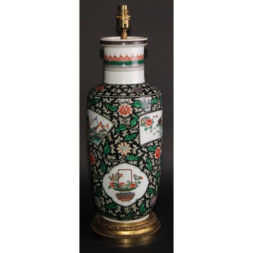 224 - A Chinese famille verte rouleau vase, painted with shaped vignettes of flowers, baskets and landscap... 
