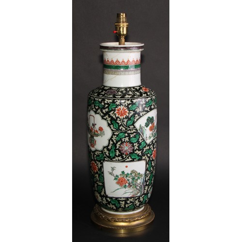 224 - A Chinese famille verte rouleau vase, painted with shaped vignettes of flowers, baskets and landscap... 
