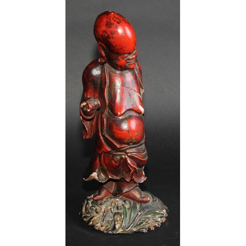 239 - A Chinese cinnabar and polychrome lacquer figure, of Shoulao, holding a peach, 32cm high