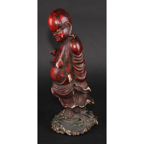 239 - A Chinese cinnabar and polychrome lacquer figure, of Shoulao, holding a peach, 32cm high