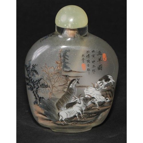 244 - A Chinese inside painted flattened ovoid snuff bottle, decorated with verse, and goats grazing an ou... 