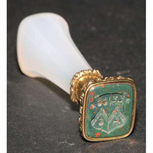 1176 - A 19th century gold mounted chalcedony desk seal, blood agate armorial matrix, 6.5cm long

Heraldry:... 