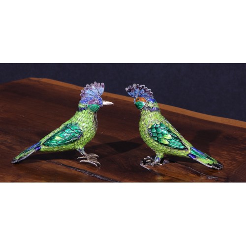 1193 - A pair of Indian silver coloured metal and polychrome enamel models, of exotic birds, 9.5cm long