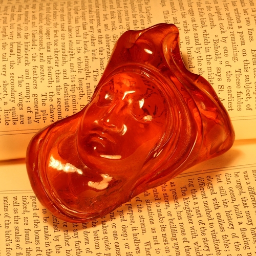 1266 - Alfred Lyndhurst Pocock (1882 - 1962), an amber carving, Juno, 8cm long, signed, monogrammed, dated ... 