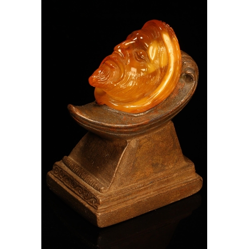 1272 - Alfred Lyndhurst Pocock (1882 - 1962), an amber carving, the head of a bearded man, sculpted terraco... 