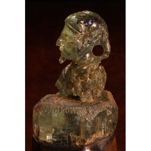 1275 - Alfred Lyndhurst Pocock (1882 - 1962), an aquamarine carving, of a gentleman, bust length, copper pl... 