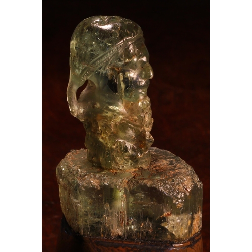 1275 - Alfred Lyndhurst Pocock (1882 - 1962), an aquamarine carving, of a gentleman, bust length, copper pl... 