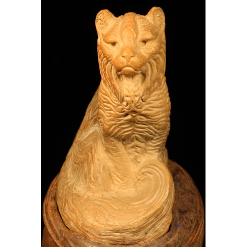 1253 - Alfred Lyndhurst Pocock (1882 - 1962), a terracotta cabinet sculpture, of a cat, seated, 12.5cm high... 