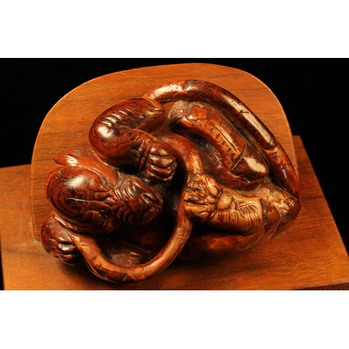 1203 - Alfred Lyndhurst Pocock (1882 - 1962), a burr wood carving, of a tiger grappling with a snake, 8.5cm... 