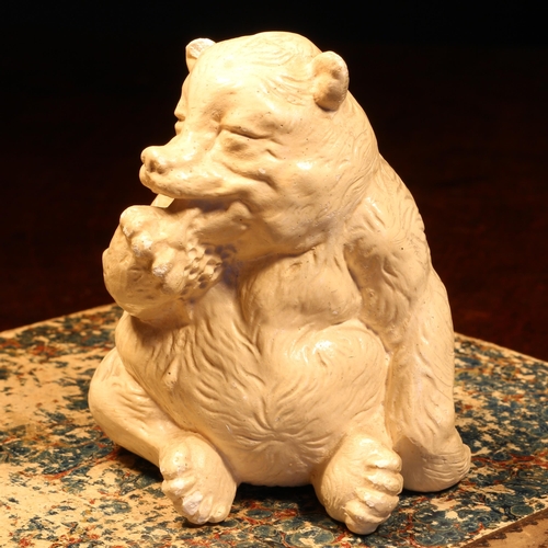 1239 - Alfred Lyndhurst Pocock (1882 - 1962), a plaster cabinet sculpture, of a bear, comically licking his... 