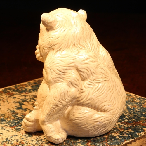 1239 - Alfred Lyndhurst Pocock (1882 - 1962), a plaster cabinet sculpture, of a bear, comically licking his... 