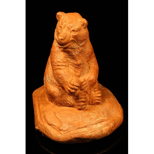 1256 - Alfred Lyndhurst Pocock (1882 - 1962), a terracotta cabinet sculpture, of a seated bear, 8cm high, s... 