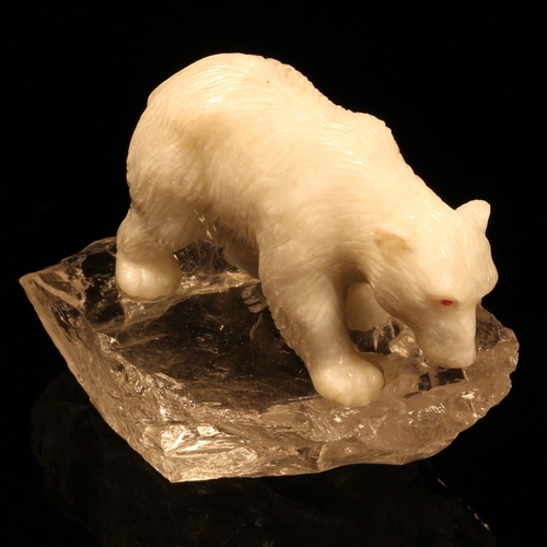 1258 - Alfred Lyndhurst Pocock (1882 - 1962), a white onyx carving, of a polar bear, four square upon a roc... 