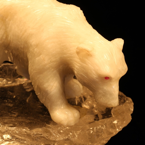 1258 - Alfred Lyndhurst Pocock (1882 - 1962), a white onyx carving, of a polar bear, four square upon a roc... 