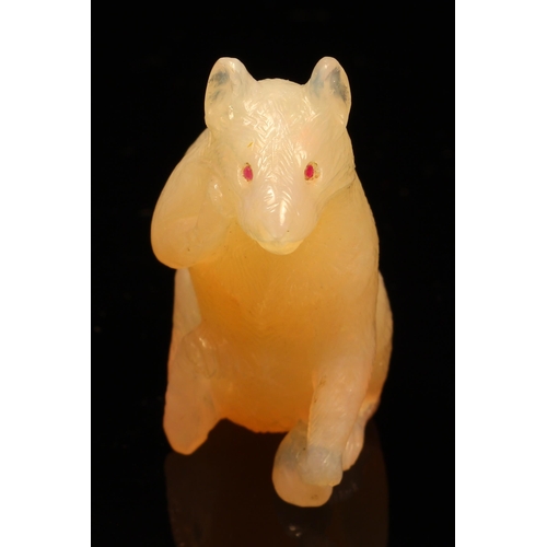 1207 - Alfred Lyndhurst Pocock (1882 - 1962), a chalcedony carving, of a rat, seated upright, gem set eyes,... 