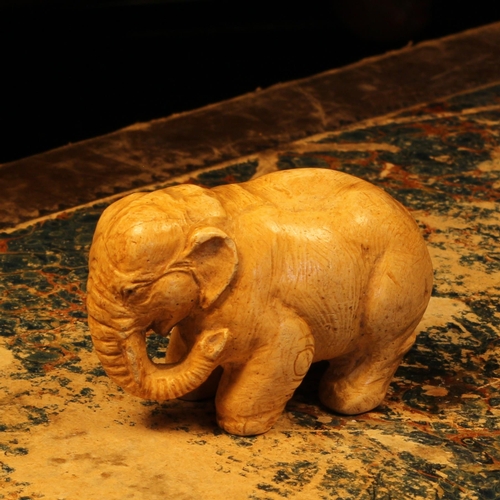 1241 - Alfred Lyndhurst Pocock (1882 - 1962), a plaster model, of an elephant, 5cm long