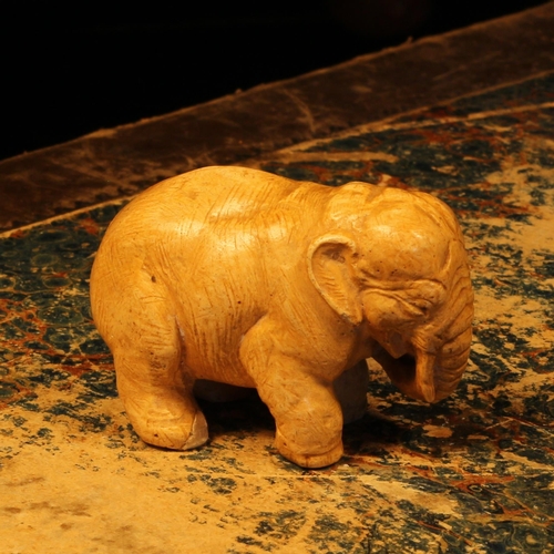 1241 - Alfred Lyndhurst Pocock (1882 - 1962), a plaster model, of an elephant, 5cm long