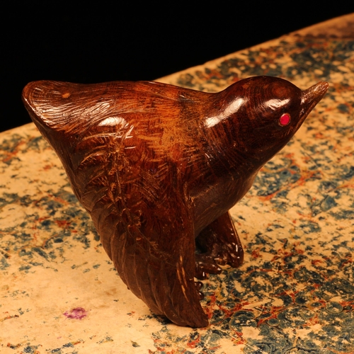 1219 - Alfred Lyndhurst Pocock (1882 - 1962), a hardwood carving, of a bird, ruby eyes, 6cm high, signed