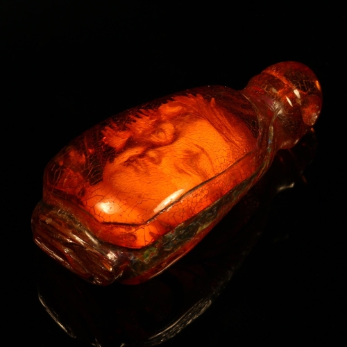 1264 - Alfred Lyndhurst Pocock (1882 - 1962), an amber carving, Alice Through the Magic Glass, internally w... 