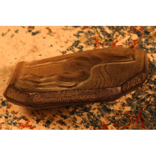 1281 - An Art Deco terracotta buckle, probably by Alfred Lyndhurst Pocock (1882 - 1962), in relief with a h... 