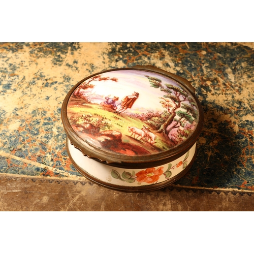 1171 - A 19th century enamel circular table snuff box, hinged cover painted with young shepherds in a pasto... 