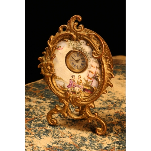 1282 - An early 20th century gilt metal mounted enamel cartouche shaped boudoir timepiece, 1.75cm circular ... 