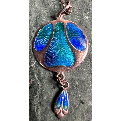 1018 - An Arts & Crafts silver and enamel pendant, decorated in the Art Nouveau taste in mottled tones of b... 